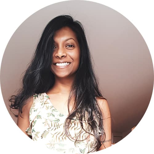 Ruha, web designer and digital strategist, is smiling at the camera